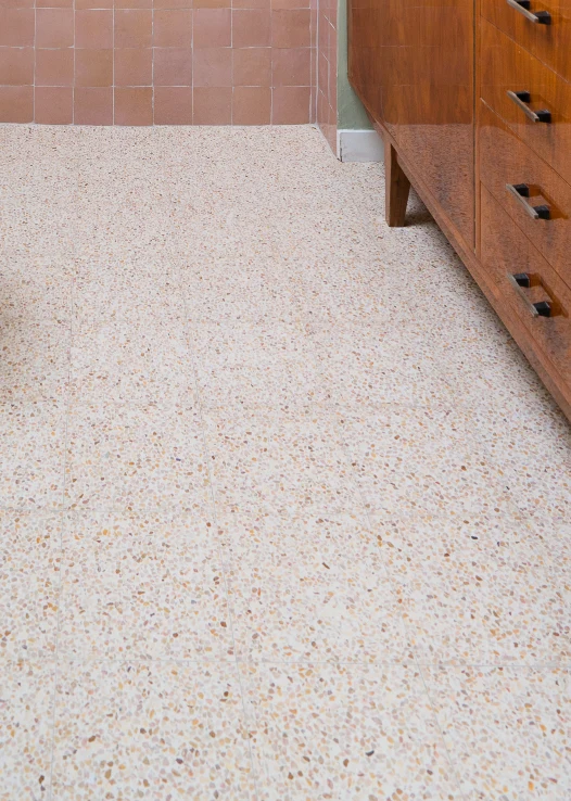 A floor decorated in white, cream, beige and brown terrazzo