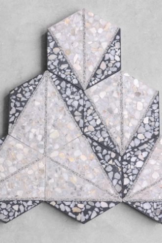 The terrazzo flooring is composed of white, cream, and gray triangles