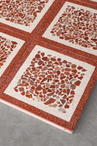 Terrazzo tiles in cream and red color