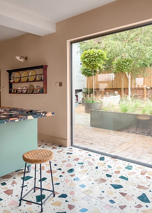 the floor and the worktop of the kitchen are made with multicolored terrazo